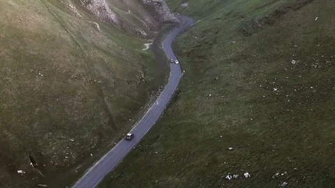 Stunning aerial car tracking shot through beautiful mountains at sunset 2 Stock Footage 105308053