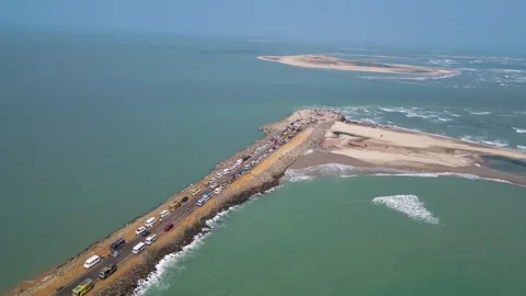 Stunning aerial drone shot capturing the serene beauty of Dhanushkodi and the Stock Footage 297595977
