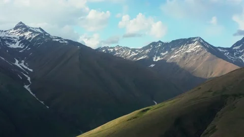 Stunning aerial panoramic view of continuous mountain range with trails of Stock Footage 162547942