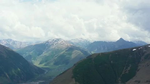 Stunning aerial panoramic view of continuous mountain range. Bright day, Stock Footage 162548042