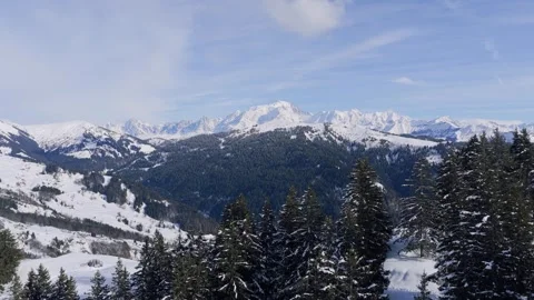 A stunning aerial panoramic view over the snow-covered Col des Aravis mountain Stock Footage 346664984