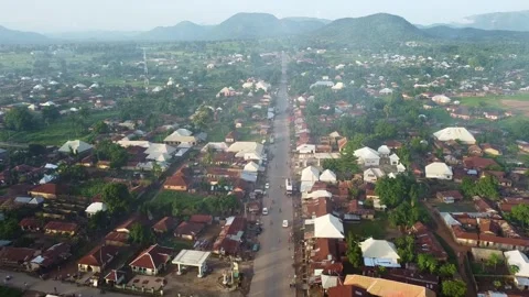 Stunning aerial perspective capturing a tranquil African town nestled amidst Stock Footage 314404513