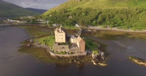 Stunning aerial shot of Eilean Donan castle in the Scottish highlands Stock Footage