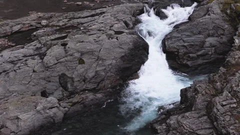 Stunning aerial top down view of a powerful stream with white water rapids .. Stock Footage 323971663