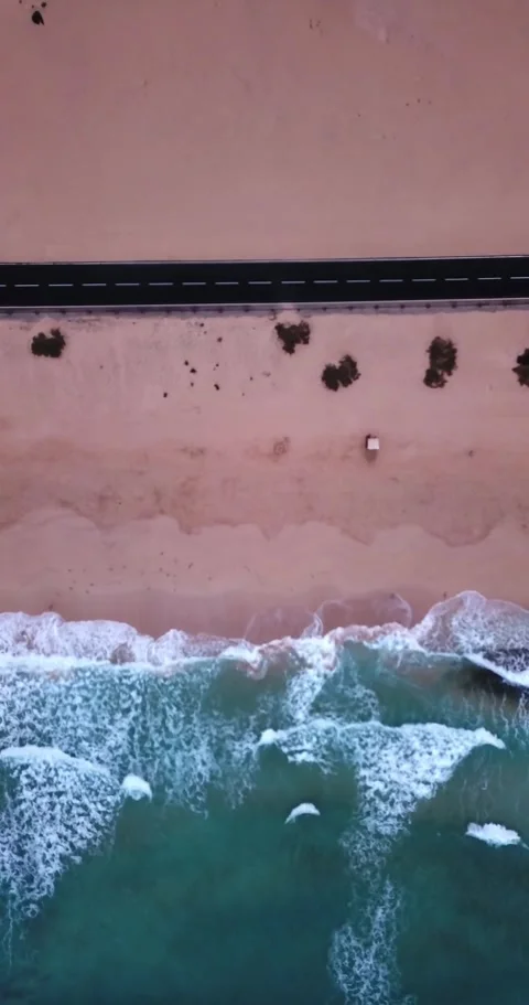 Stunning aerial top-down view showing the contrast between the turquoise ocean Stock Footage 344820678