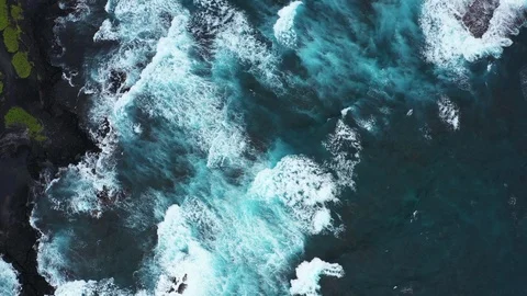 Stunning Aerial Topdown View of Rolling Waves at Punalu'u Black Sand Beach Stock Footage 125794329