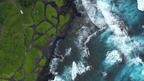 Stunning Aerial Topdown View of Rolling Waves at Punalu'u Black Sand Beach Stock Footage 125797261