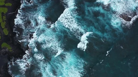 Stunning Aerial Topdown View of Rolling Waves at Punalu'u Black Sand Beach Stock Footage 125797793