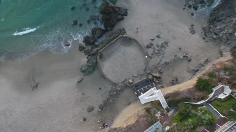 Stunning Aerial Topdown View of Rolling Waves at Laguna Beach Tide Pools Stock Footage 157189990