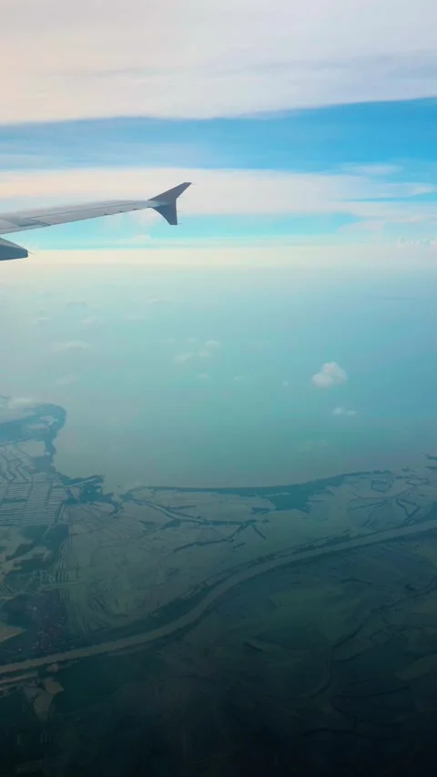 Stunning aerial view from airplane window revealing diverse land and sky du.. Stock Footage 333840539