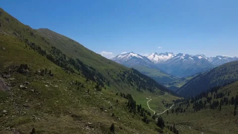 Stunning Aerial View of Austrian Alps Valley in Summer with Majestic Snow-c.. Stock Footage 327728290