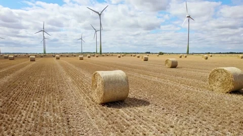 A stunning aerial view captures wind turbines in a row, turning gracefully .. Stockbeeldmateriaal 252657016