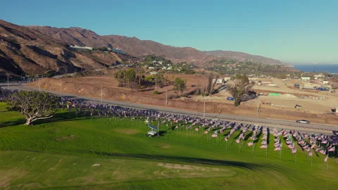 Stunning Aerial View Capturing Hillside Flags Against a Beautiful Scenic Vídeo Stock 317140195