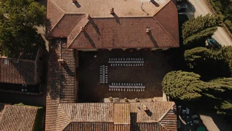 Stunning Aerial View of a Charming Rustic Building Surrounded by a Serene Stock Footage 307428340