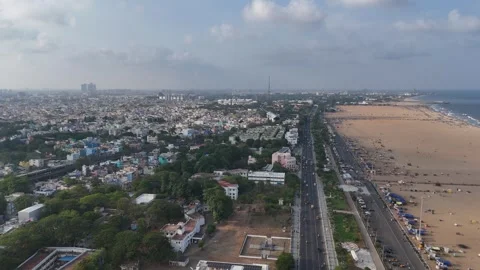 A stunning aerial view of Chennai’s iconic Marina Beach filled with crowd Stock Footage 305141833