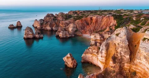 Stunning aerial view of cliffs and coastline in Portugal at sunset Stock Footage 312326669