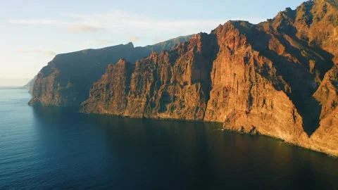 Stunning Aerial View of Dramatic Rocky Cliffs Over Ocean Stock Footage 323298451