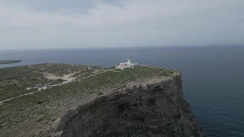 Stunning aerial view of Far de la Cavalleria in Minorca, Balearic Islands Видео 303752557