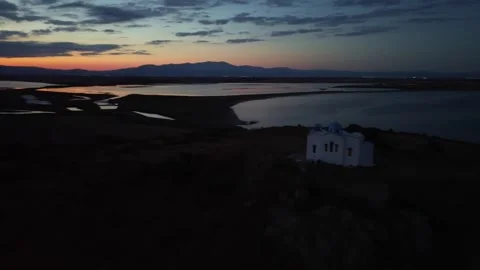 Stunning Aerial View of a Mountain Summit with a Tiny Church at the Top in Video stock 302552133