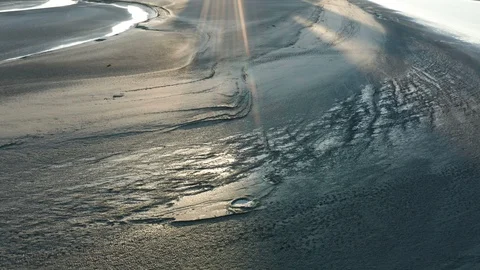 Stunning aerial view of mud flats and sunrise or sunset Stock Footage 120016141