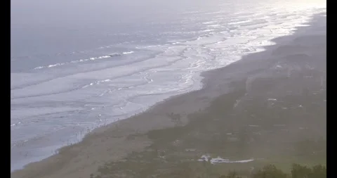 Stunning Aerial View of Ocean Waves and Sandy Beach from Paralayang Hills N.. Stock Footage 302473687