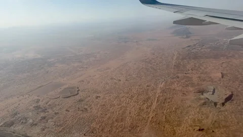 Stunning aerial view of rugged mountains and vast desert landscape from an .. Stock Footage 332792292