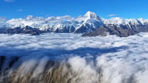 Stunning Aerial View of Snow Capped Peaks Above Cloud Sea Sichuan China Stock Footage 346574114