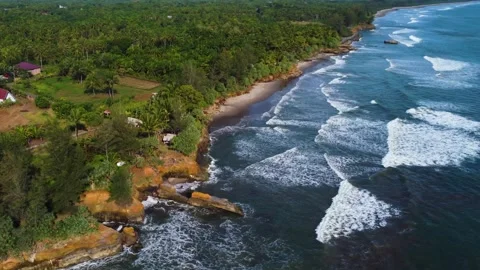 Stunning aerial view of towering cliffs by Bengkulu beach Stock Footage 289404148
