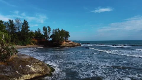 Stunning aerial view of towering cliffs by Bengkulu beach Stock Footage 289404149