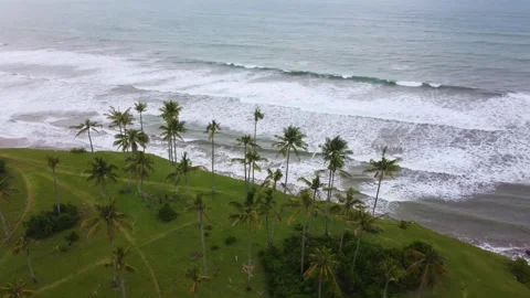 Stunning aerial view of towering cliffs by Bengkulu beach Stock Footage 289404150