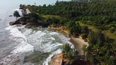 Stunning aerial view of towering cliffs by Bengkulu beach Stock Footage 289404156