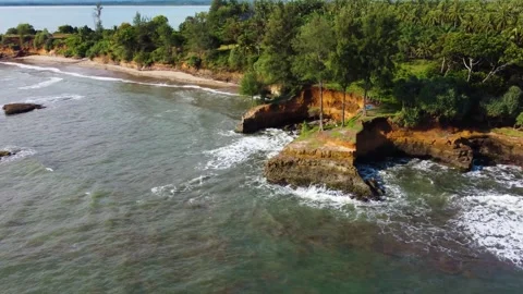 Stunning aerial view of towering cliffs by Bengkulu beach Stock Footage 289404166