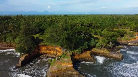 Stunning aerial view of towering cliffs by Bengkulu beach Stock Footage 289404168