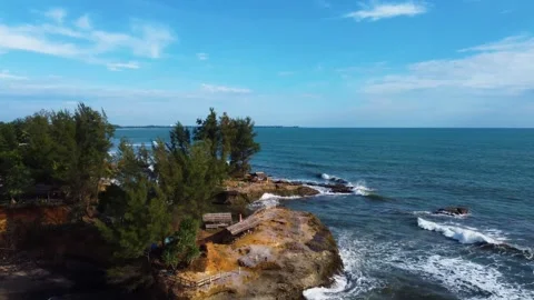 Stunning aerial view of towering cliffs by Bengkulu beach Stock Footage 289404169
