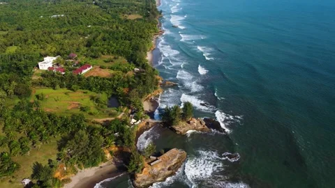Stunning aerial view of towering cliffs by Bengkulu beach Stock Footage 289404174