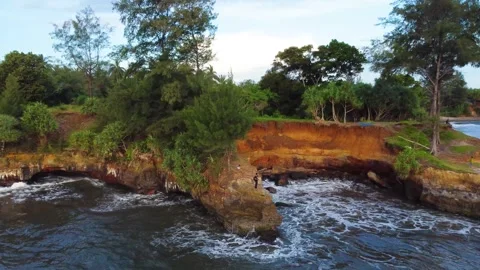 Stunning aerial view of towering cliffs by Bengkulu beach Stock Footage 289404177