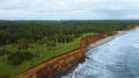 Stunning aerial view of towering cliffs by Bengkulu beach Stock Footage 289404186