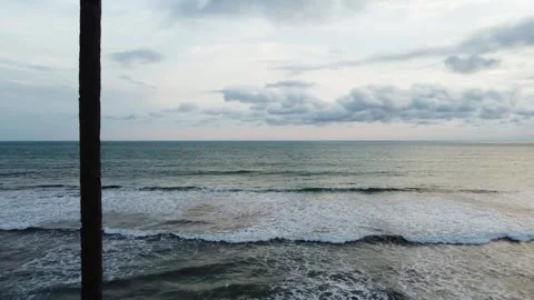 Stunning aerial view of towering cliffs by Bengkulu beach Stock Footage 289404191
