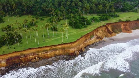 Stunning aerial view of towering cliffs by Bengkulu beach Stock Footage 289404366