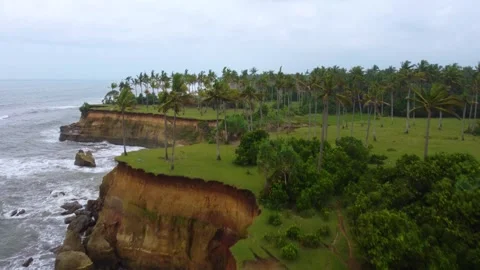 Stunning aerial view of towering cliffs by Bengkulu beach Stock Footage 289404494