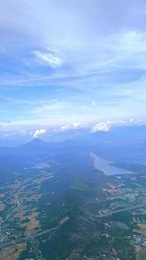 Stunning Aerial View of a Winding River Through Green Mountains Stock Footage 321890878