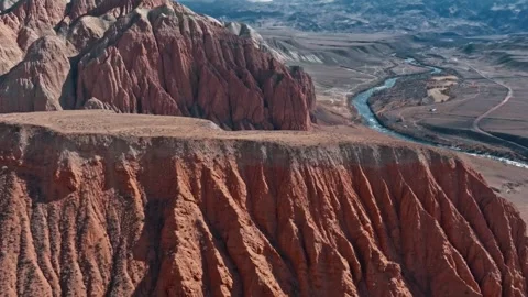 Stunning aerial views of rugged cliffs and winding river 動画素材 320293443