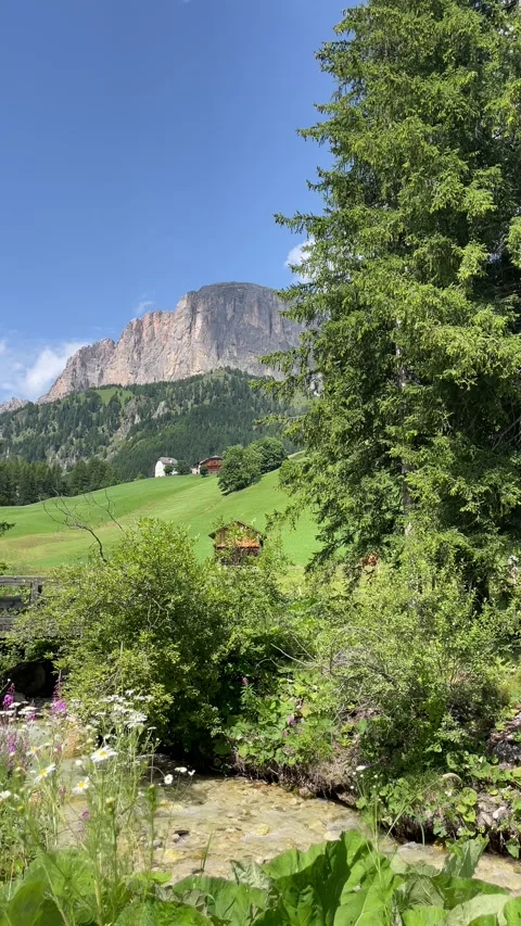 Stunning alpine mountain view with stream, mountain peak Stockbeeldmateriaal 284463067