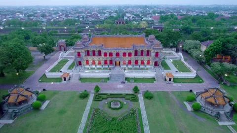 Stunning Up and Backwards Drone Shot of Kiến Trung Palace and the Hue Citadel Stock Footage 276932061