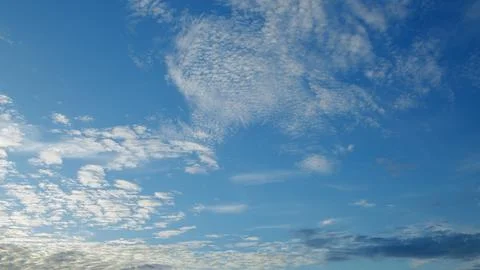 Stunning and Beautiful Cloud Patterns Hovering Gracefully Under a Clear, Blue Sk Stock Photos