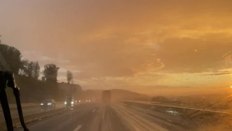 The Stunning and Dramatic Sunset Rainstorm Over the Expansive Highway Natures Stock Footage 315346303
