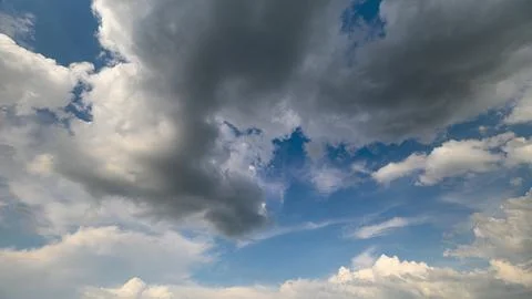 A Stunning and Dynamic Cloud Formation Spreading Across a Bright and Vibrant Blu 写真素材