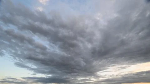 Stunning and Dynamic Cloud Patterns Appearing at Sunset in a Beautiful Landscape Stock Photos