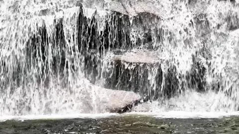 A Stunning and Flowing Waterfall Featuring Beautiful Cascades and Scenic La.. Stock Photos
