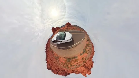 A stunning and unique 360degree view that showcases a car gracefully navigating Stock Footage 306039340
